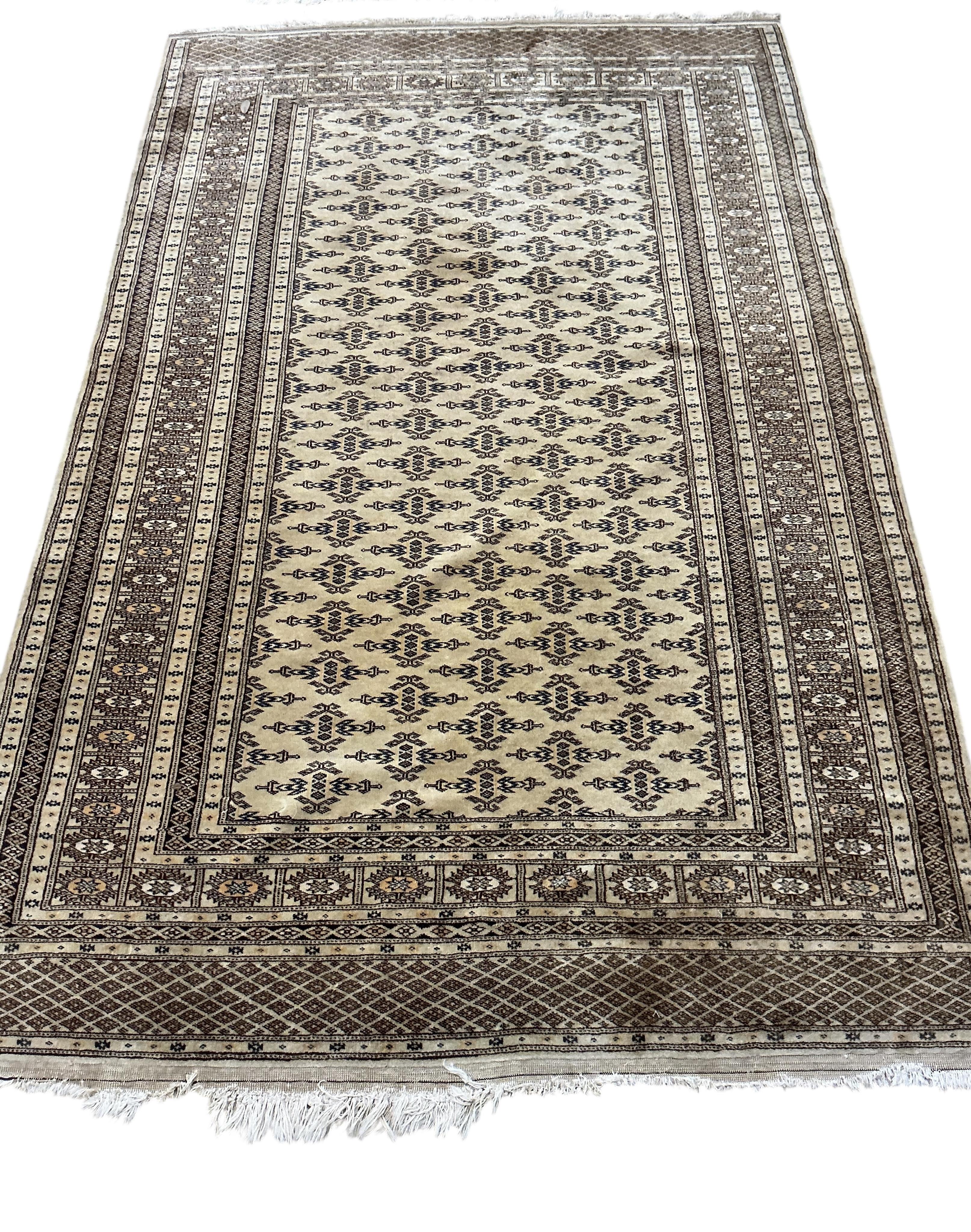 A North West Persian fawn ground rug, 196 x 126cm together with a flatweave rug